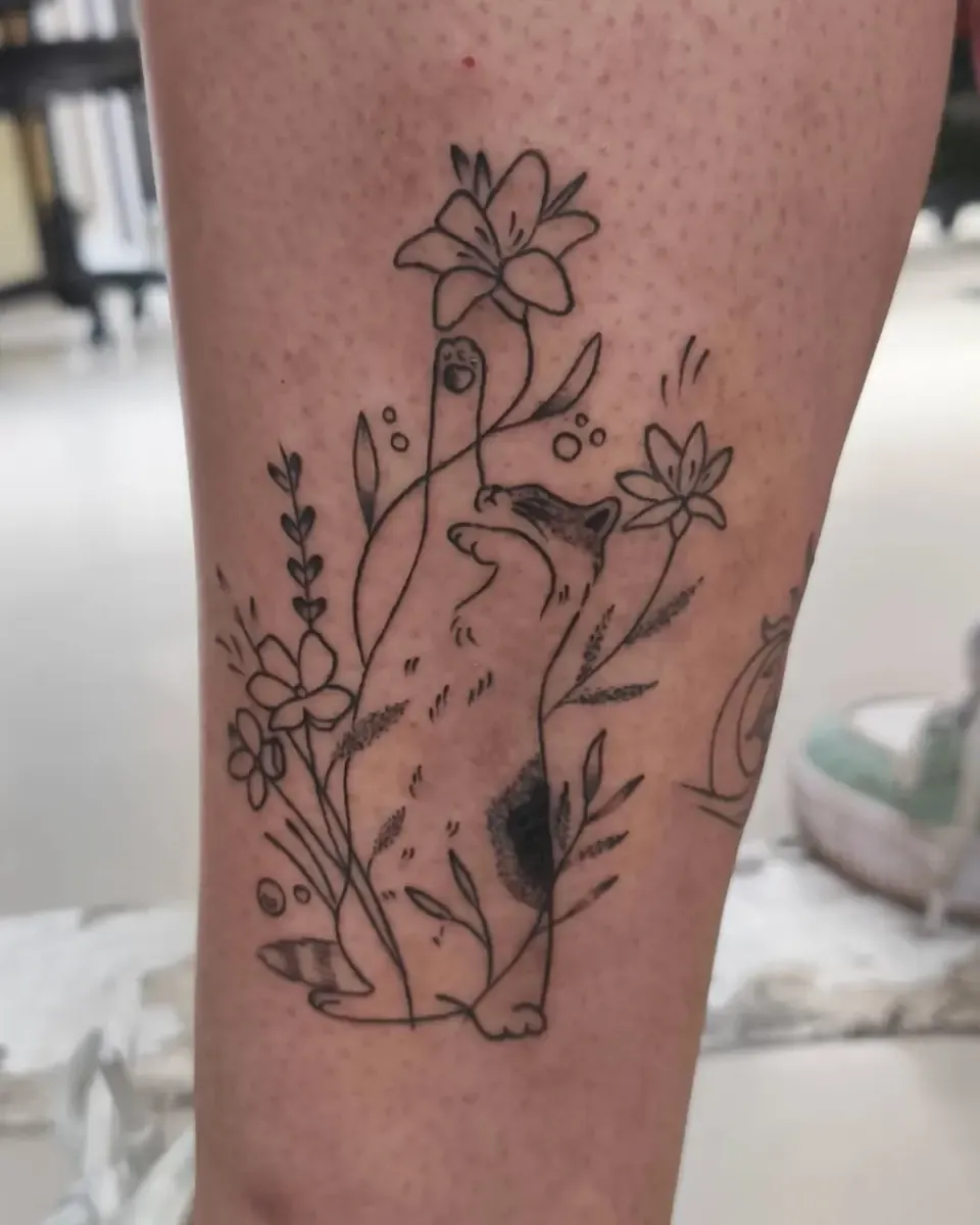 Tatuaje de flores silvestres en línea fina en la pierna